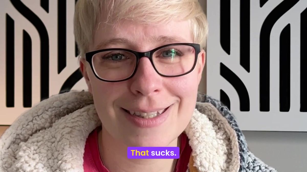Jenny Lucas speaking to camera and smiling, with captions